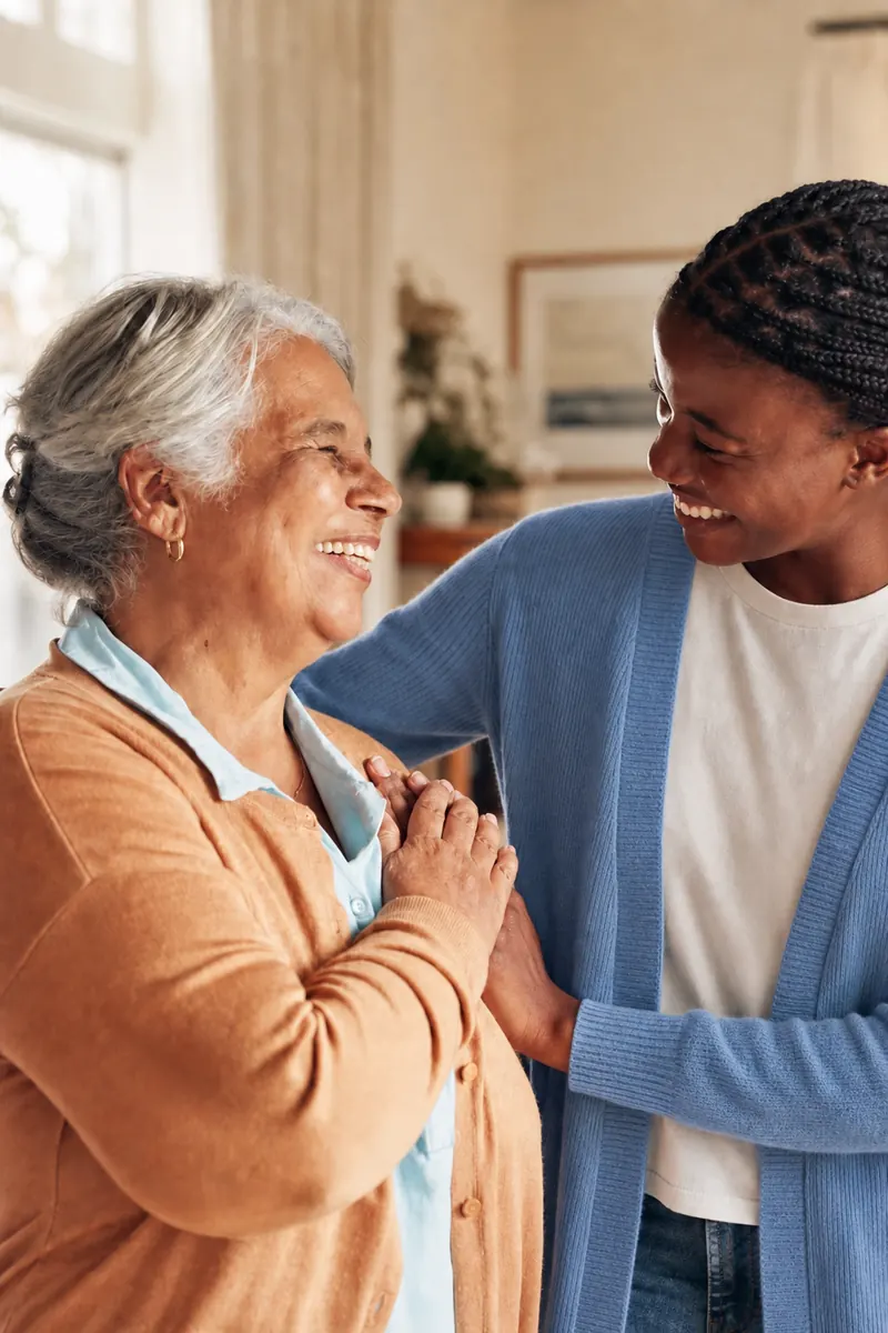 A chaplain holding hands with an elderly patient in spiritual support